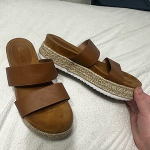 Brown double strap platform espadrilles.